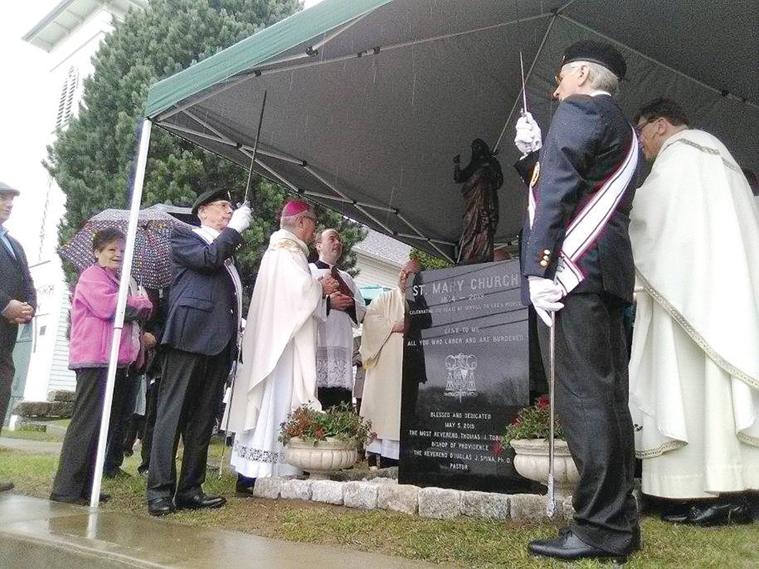 Bishop Tobin blesses and dedicates a new shrine outside the church to the Sacred Heart of Jesus.